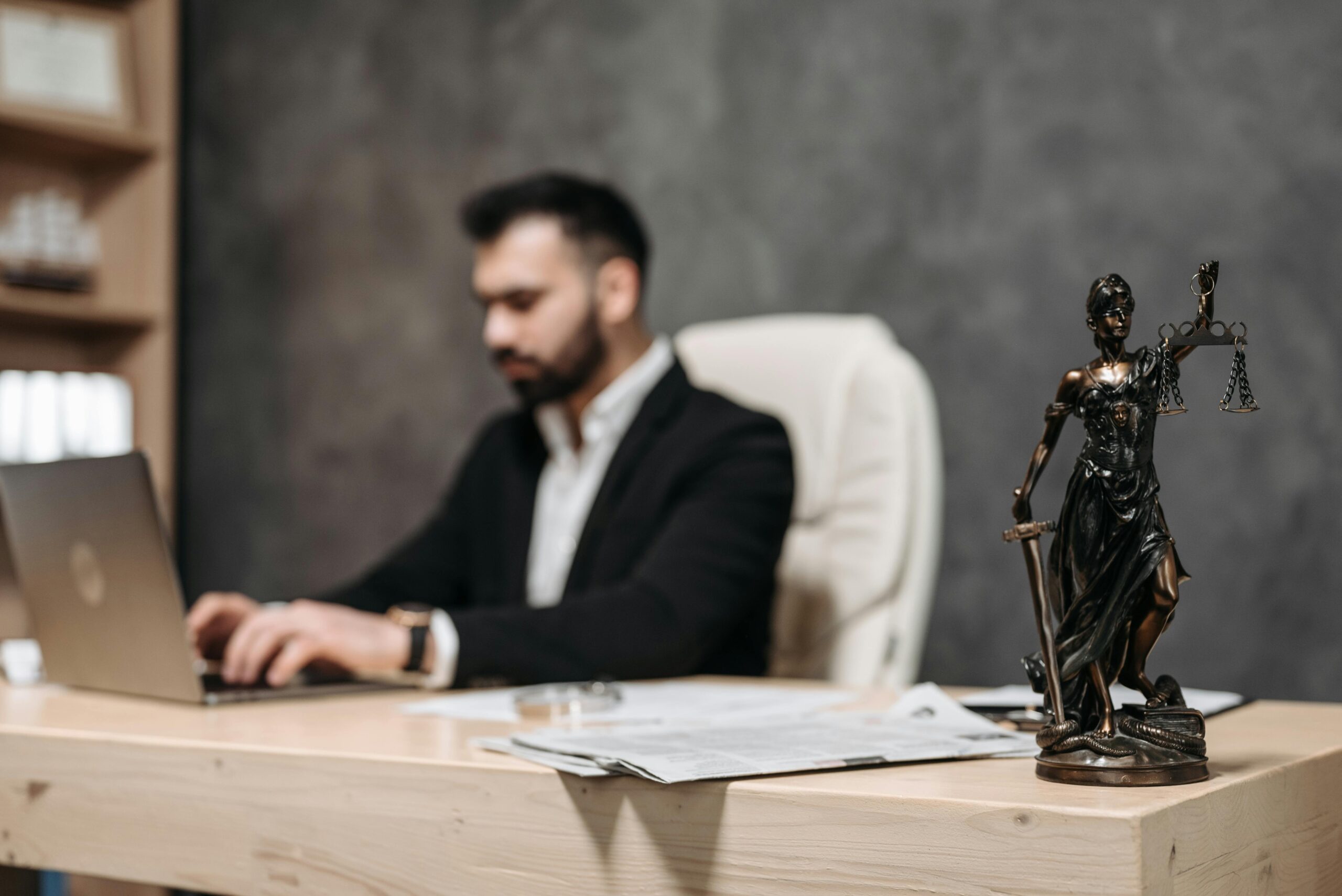 A male lawyer using his work laptop